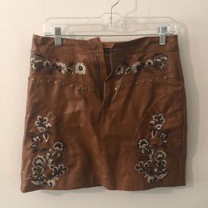 Brown leather, flower stitch detail skirt